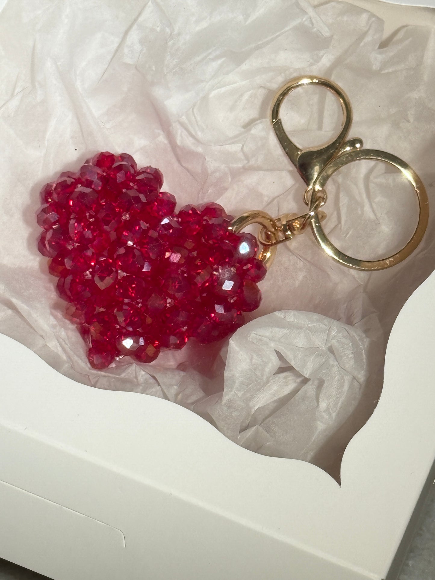 Red beaded heart keychain on a white background in a gift box