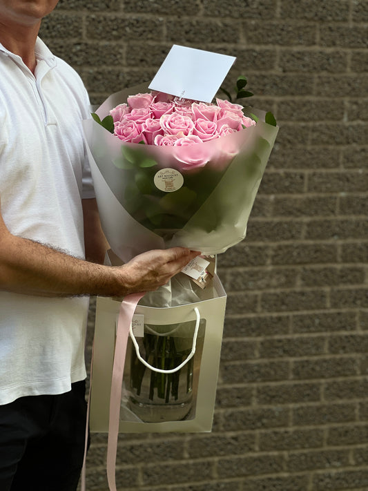 23 gorgeous pink roses with light green edging. Ideal for birthdays, anniversaries, or wedding bridesmaid bouquets in Montreal.